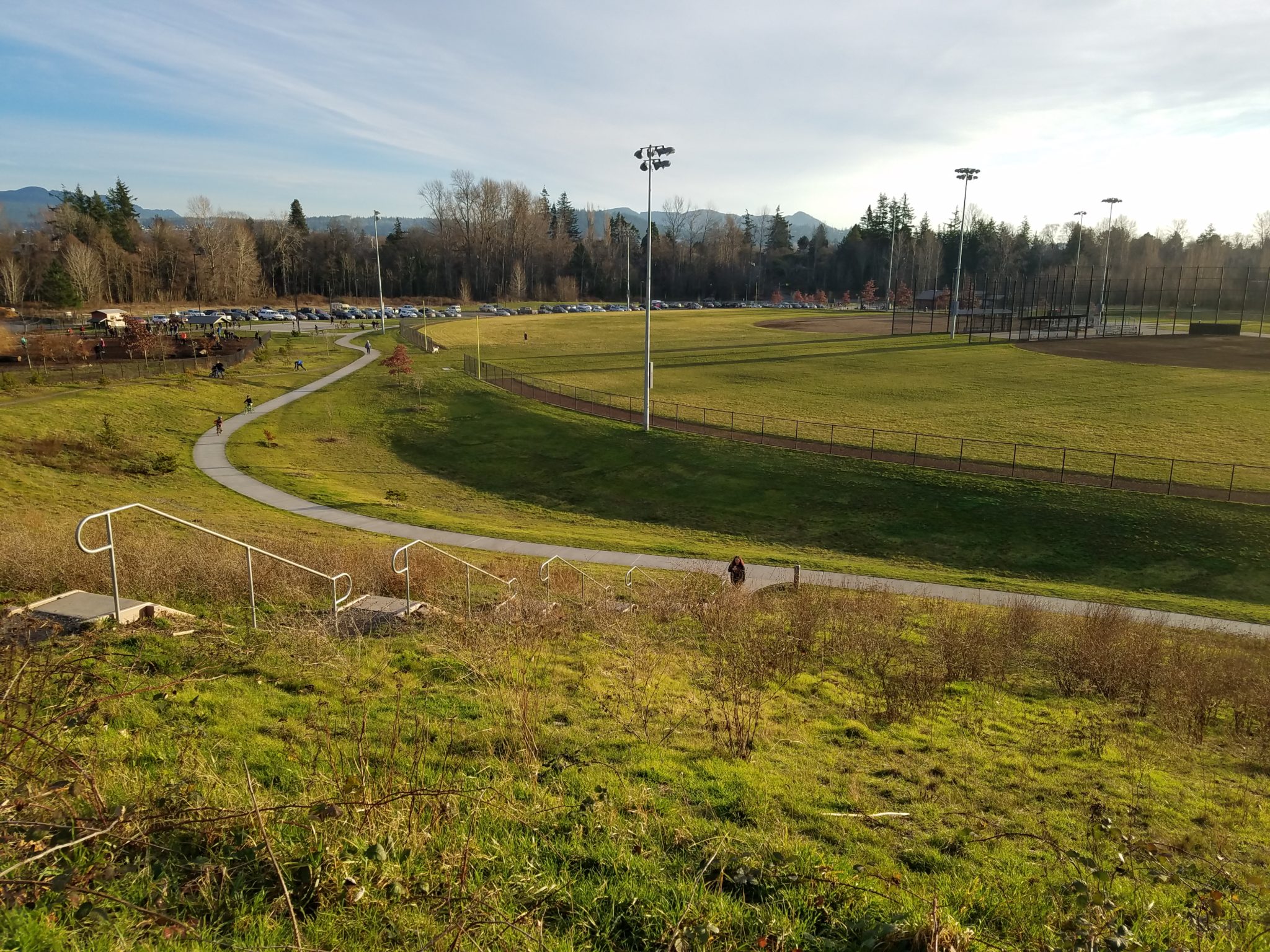 This is a view of the ball field infiltration basins and trail. Water from under the ball fields and from the adjacent hillside collect in these basins where it is infiltrated into the ground.