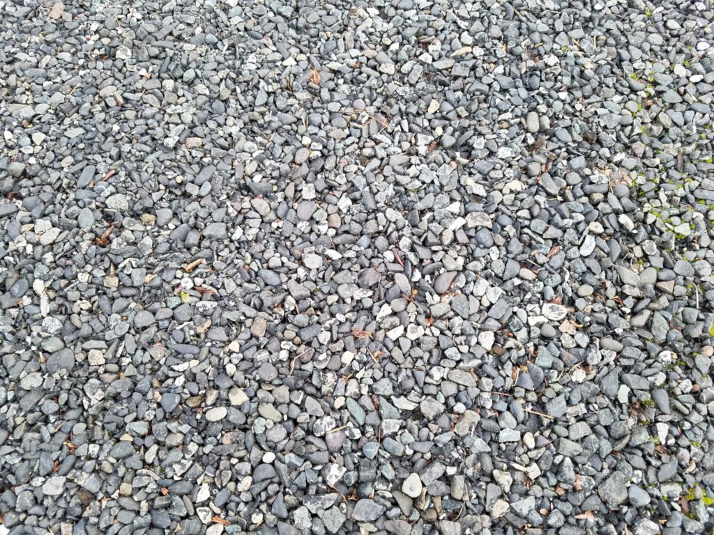 Here is a close up of porous asphalt which eliminates the need for costly drainage systems. Its rough surface creates good traction on the hill slope.
